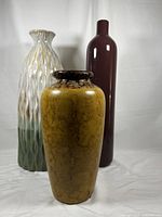 Front angle photo of the trio of vases showing their colors and shapes.