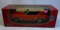 Photo showing boxed red 1964 1/2 Ford Mustang diecast model in display packaging
