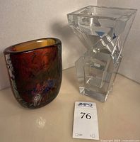 Front view of Baccarat crystal sculpture (right) and Kosta Boda multicolor glass vase (left)