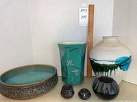 Overview of all six items: shallow oval bowl, green hexagonal vase, large drip-glazed pot, and three small decorative pots.