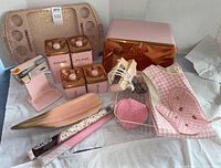 Overview of all pink kitchen items on table