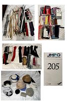Belts arranged on a surface showcasing varied fabrics and colors alongside stacks of scarves with diverse patterns, also showing various gloves primarily in black and red hues, and different styles of hats and headbands including a white faux fur hat.