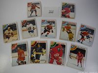 Full view of all 11 1978 O-Pee-Chee hockey cards arranged with visible team logos and player images in protective sleeves.