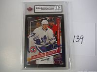 Front of Auston Matthews 2016-17 Upper Deck Hockey Card Day rookie card showing player image, team logo, and grading label.