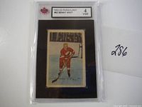 1952-53 Parkhurst Benny Woit hockey card in protective case with grading label showing grade 4 VG-EX and card number 62.