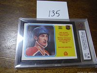 Front side of the 1982-83 O-Pee-Chee Wayne Gretzky hockey card graded 7.5 showing color illustration and team logo.