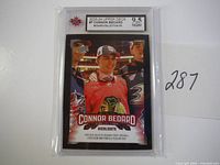 Front of Connor Bedard rookie card graded 9.5 by NGM in sealed case showing Connor in draft jersey.