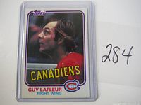 Front view of first 1981 Topps Guy Lafleur Canadiens hockey card in plastic sleeve