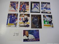 Nine Mats Sundin hockey cards displayed in three rows of three, showing various images and uniform styles.