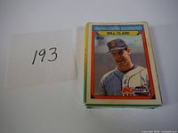 Front of unopened baseball card set featuring player Will Clark in SF Giants uniform with K-Mart logo.
