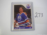 Close-up photo of one 1985 OPC Mark Messier hockey card in plastic sleeve with number 273 next to it.