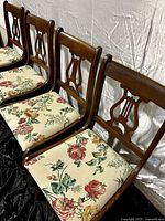 Side view of four chairs in lineup