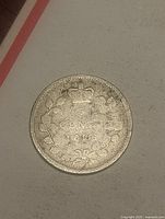 Reverse of 1896 Canadian 5 cent coin showing crown, wreath and date