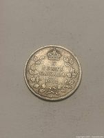 Reverse side displaying denomination, country and date within wreath