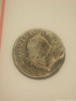 Obverse view of worn copper coin