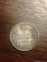 Reverse showing crown, 5 Cents Canada 1910 within maple wreath