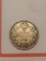 Reverse of 1914 Canada 5 cents silver coin showing crown, denomination, wreath, date