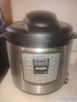Front view of Instant Pot showing control panel and exterior
