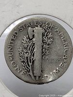 Reverse of 1940 Mercury dime in flip showing fasces and olive branch
