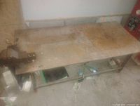 Full view of steel work table top, vise visible left side