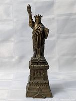 Full view of Statue of Liberty replica showing complete figure and pedestal