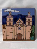 Front view of glazed tile showing full mission design and colors