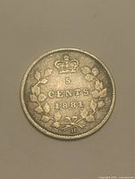Reverse of 1881 H Canada 5 cents coin showing crown, wreath, denomination and date