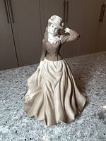 Front view of Coalport Beau Monde Meg porcelain figurine with detailed attire and pose.