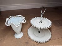 Photo showing both the milk glass vase and two-tier pastry stand together on floor.