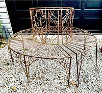 Two semicircular bench sections assembled into a circle on gravel