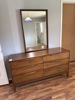Front view of six-drawer dresser with mirror assembly