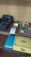 Photo showing watches, pearl necklace, costume rings, cuff links, and jewelry box.