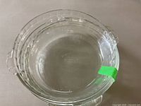 Top view showing clear Pyrex pie plate with embossed brand name on bottom