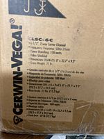 Close-up photo of the box label showing detailed specifications of the Cerwin-Vega CLSC-6C speaker including power handling, frequency response, dimensions, and weight.