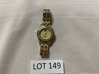 Full view of Jean Paul gold-tone watch showing bracelet and face.