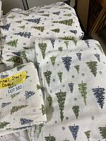 King size flannel sheet set folded and displayed, showcasing the tree pattern on white background.