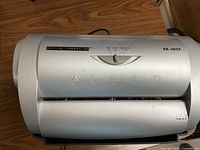 Top view of the Office Companion SE-305X paper shredder showing brand label and icons.