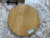 Top view of the round solid wood rotating serving board showing natural wood grain and smooth surface.
