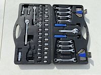 Overview of the full 61-piece tool set including sockets, socket wrench, combination wrenches, adjustable wrenches, screwdrivers, and Allen wrenches in open case
