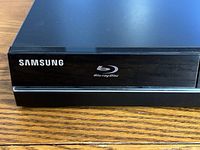 Close-up front view of Samsung Blu-ray Disc player with Samsung and Blu-ray logos visible