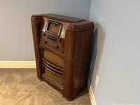 Side view of the Westinghouse Model 780 radio showing wooden cabinet with curved edges and polished finish.