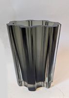 Side view of smoke grey lobed glass vase