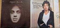 Front covers of Billy Joel's "Piano Man" and Bruce Springsteen's "Darkness on the Edge of Town" vinyl record albums