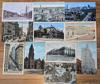Overview photo of 11 vintage postcards laid out depicting Toronto scenes including Yonge Street, Queen's Hotel, Union Station, and more.