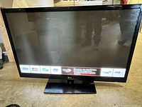 Front view of LG 50-inch plasma TV with stand, powered on showing energy, USB and feature logos
