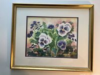Framed watercolor painting depicting purple and white pansy flowers, signed by CP Pellet in the bottom left corner.