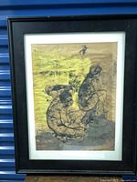 Framed artwork showing two seated female figures in midcentury style with yellow and gray background