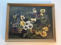 Front view of oil painting in frame showing floral composition