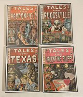 Four framed horror-themed vintage comic-style art prints displayed on a flat surface, titles visible.