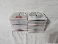 Two stacks of DVD cases showing the full quantity and uniformity of the lot